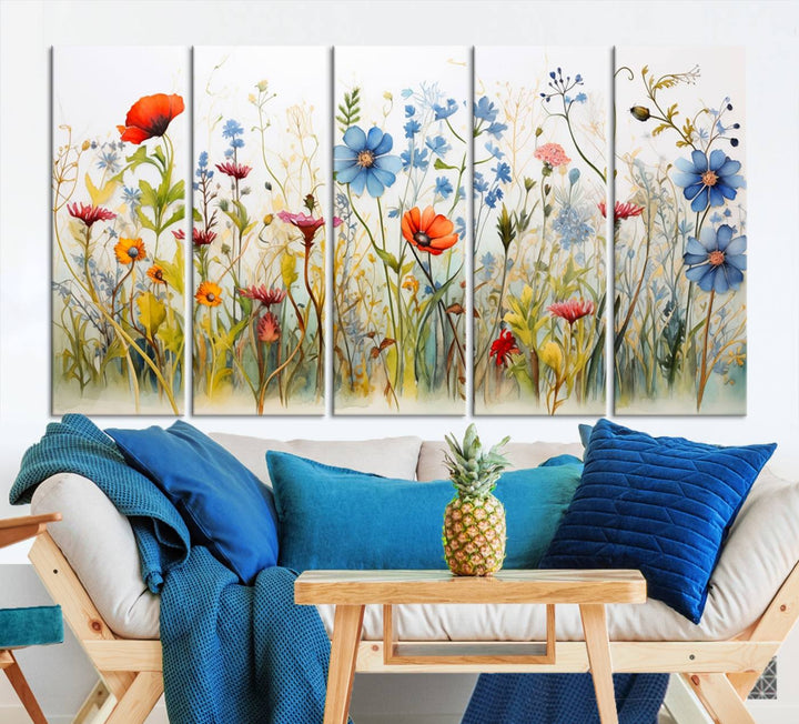 The Colorful Wildflower Canvas Wall Art – Vibrant Floral Botanical Print, consisting of a large 3 panel set, adds bright nature decor to the living room against a black wall.