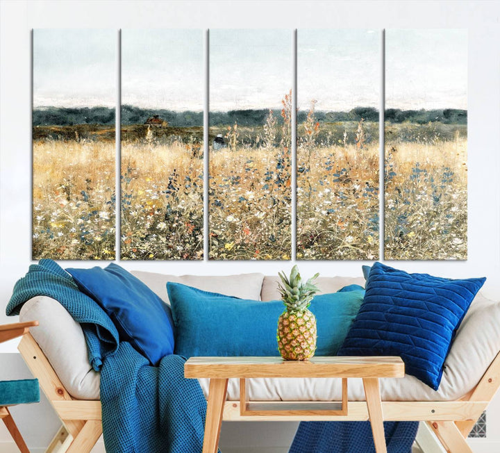 The "Wildflower Field Wall Art Canvas" brings rustic charm to the room with its nature-inspired landscape print, making it a perfect addition to the living room or office.