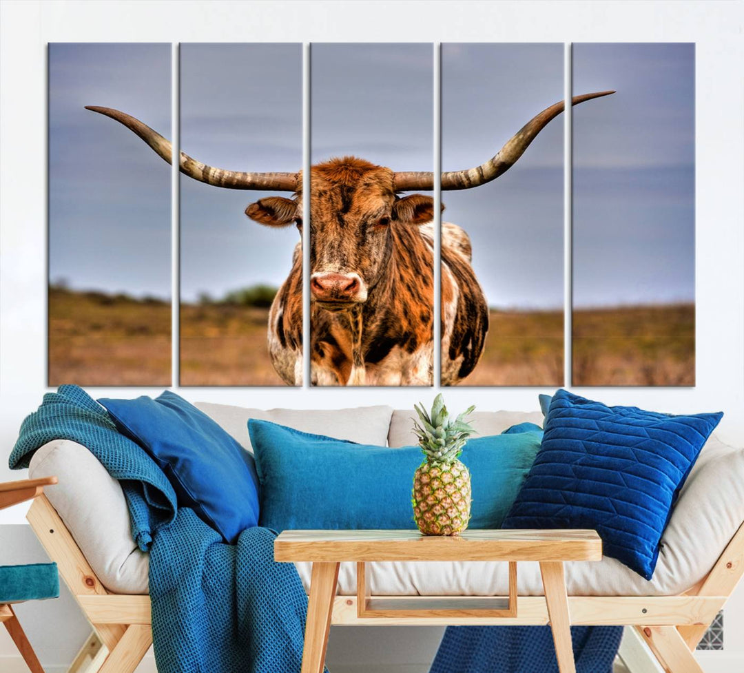 The Texas Longhorn Wall Art Print, a triptych canvas artwork depicting a longhorn bull in a field, features a gallery-quality finish.