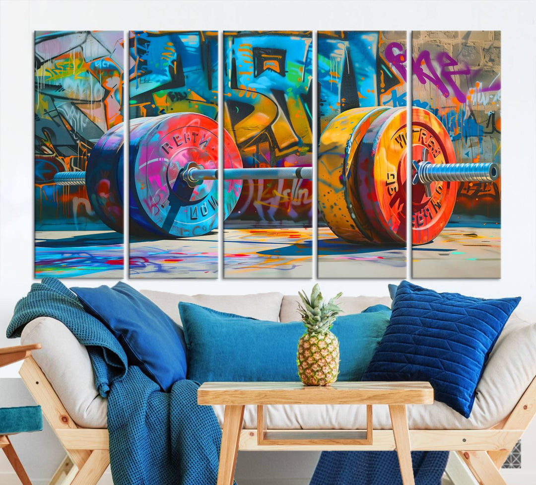 The Fitness Gym Barbell Graffiti Wall Art Canvas Print, a vibrant triptych featuring a barbell against a graffiti backdrop, elegantly hangs in the room. Crafted on premium canvas with a gallery-quality finish, this stunning piece of wall art effortlessly combines urban flair with sophisticated decor.