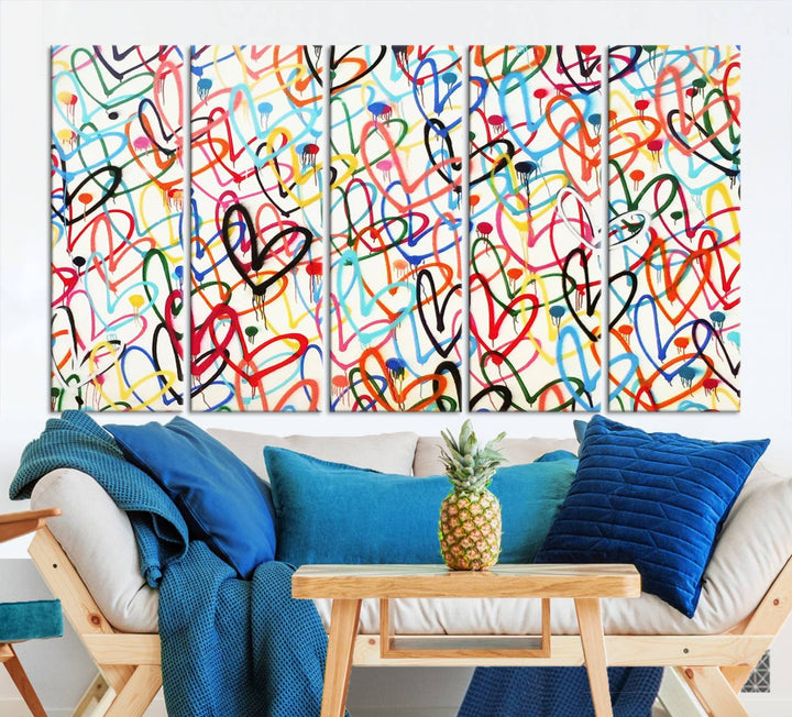 The "Colorful Love Canvas print," featuring vibrant abstract street art with overlapping loops, is handmade in the USA.