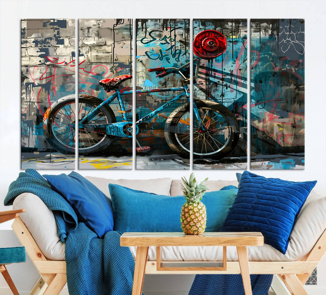 A modern living room features a triptych wall art of an abstract bicycle, designed in a graffiti style on a brick wall. This piece is expertly crafted on the Abstract Bicycle Wall Art Canvas Print, offering a premium canvas that ensures a gallery-quality finish.