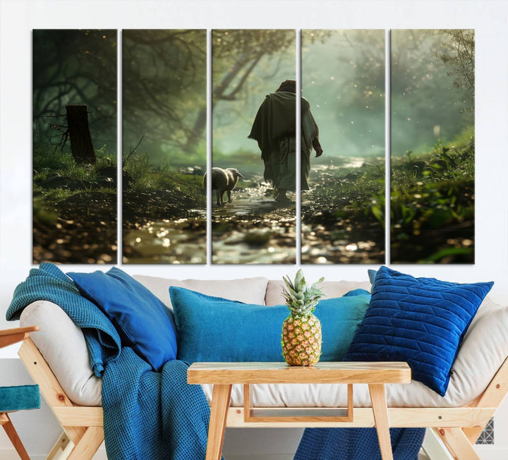 The wall art piece, titled "Jesus Shepherd a Lost Lamb Canvas Wall Art Print," is suspended on the wall and depicts a robed figure and a lamb wandering along a forest path.