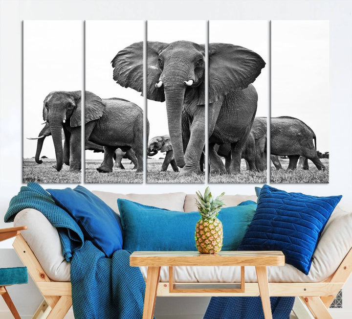 The Black White Elephant Family Wall Art Canvas Print features a triptych of elephants walking in the wild, crafted as gallery-quality wall art on premium canvas.