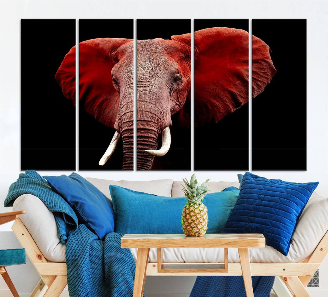 A Wall Art Canvas Print in the modern living room features a three-panel premium design of a red elephant face.