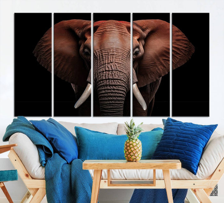 A stunning triptych titled "Wild Elephant Wall Art Canvas Print" beautifully enhances the wall above a contemporary living room. This Africa Savannah Wild Animal Wall Decor Print is of museum-quality, complete with a UV-protective coating to ensure its vibrancy and beauty are preserved for years.