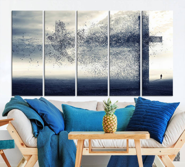 The "Jesus and the Fading Cross – Symbol of Faith" framed canvas print beautifully depicts a cross formed by birds against a moody sky above an ocean. This piece of Christian wall art infuses spirituality into the minimalist space.