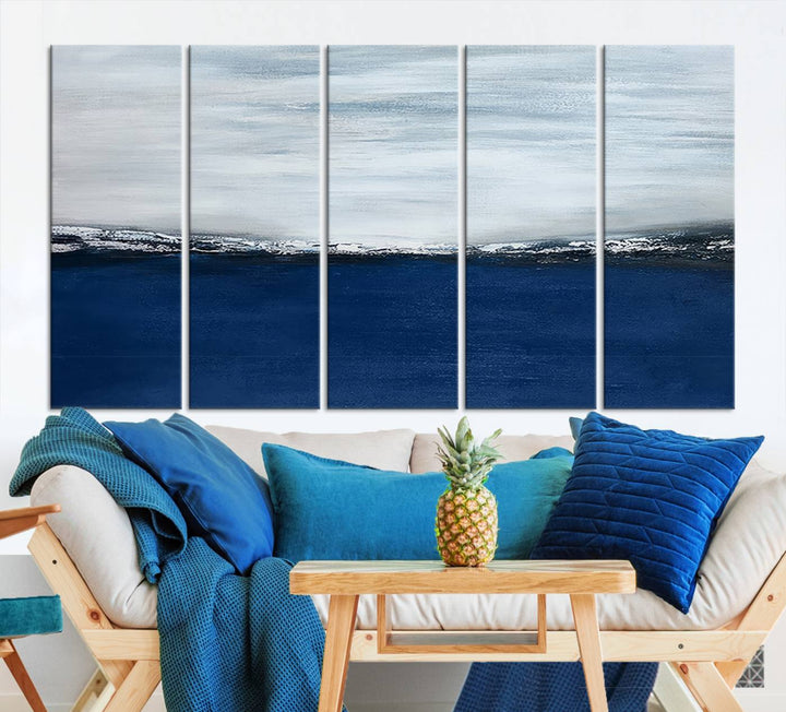 The modern living room is enhanced by the Navy Blue Abstract Wall Art Canvas Print on the wall, crafted as handmade wall art with a gallery-quality finish.