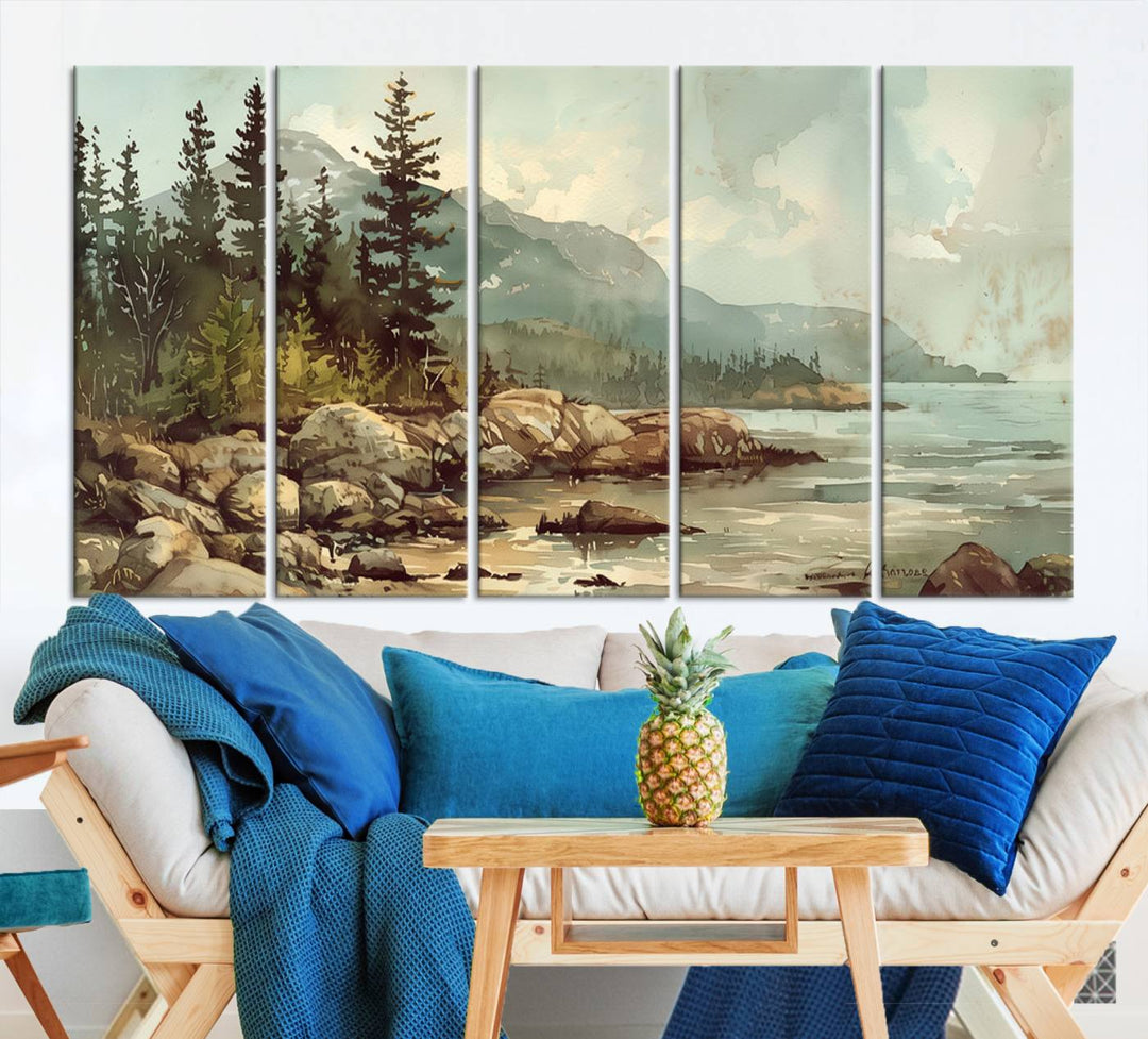 The living room features a breathtaking three-panel Abstract Acadia National Park Wall Art Canvas Print, which beautifully captures the rocky Maine coastline with trees and mountains.