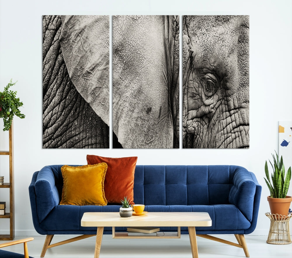 A modern living room features a large Elephant Wall Art Canvas Print in black and white, crafted on museum-quality canvases with UV-protective coating to maintain its elegance.