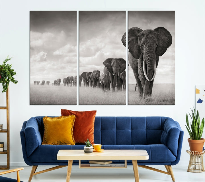 The "Herd of Elephants Wall Art Canvas Print" features an elegant black and white triptych of elephants walking in a line, beautifully displayed on museum-quality canvas with a UV-protective coating. This artwork arrives ready to hang and adds sophistication to any space.