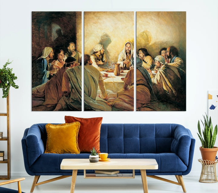 A cozy living room showcases a three-panel canvas titled "The Last Supper Canvas Wall Art – Sacred Religious Masterpiece," depicting people gathered at a table reminiscent of the Last Supper.