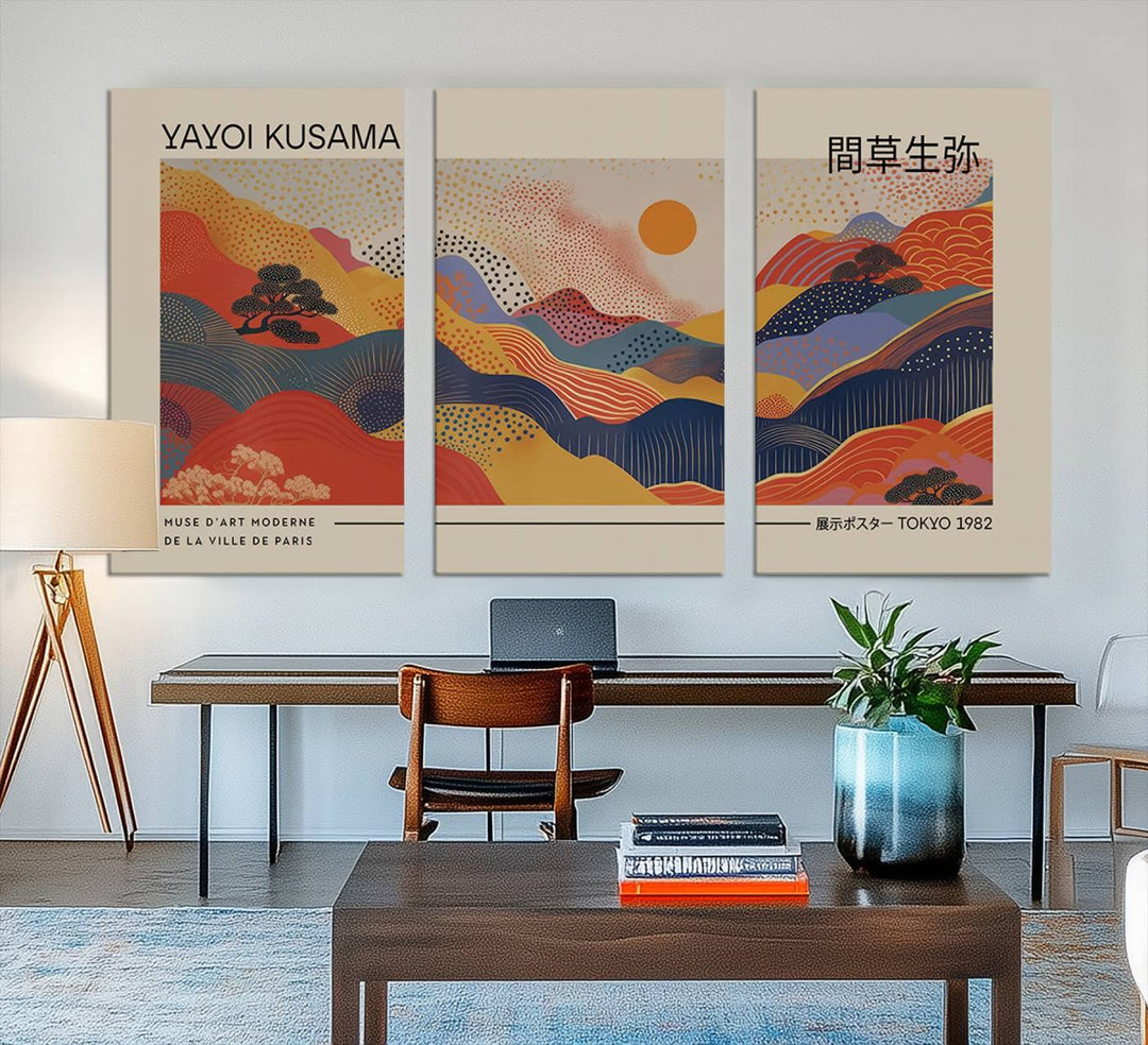 The Yayoi Kusama vibrant landscape canvas print featuring abstract mountains and a sun enhances the space with its modern aesthetic.