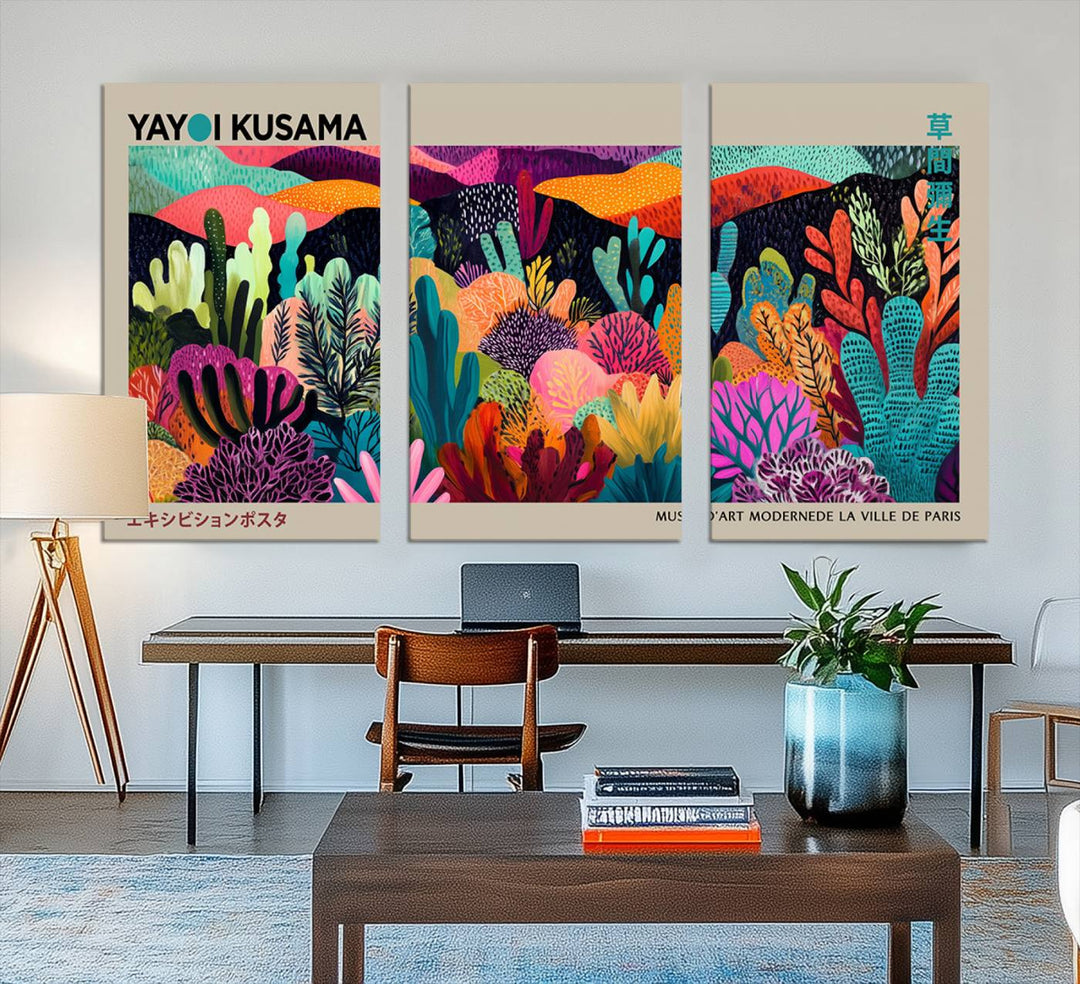 The framed Yayoi Kusama wall art adds vibrancy above the blue couch.