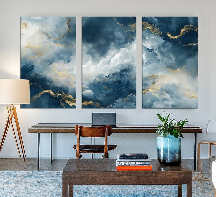 Modern living room featuring the Large Abstract Print - Luxe Blue and Gold Abstract Canvas Wall Art that showcases a bold cloudscape, perfect for modern home decor.