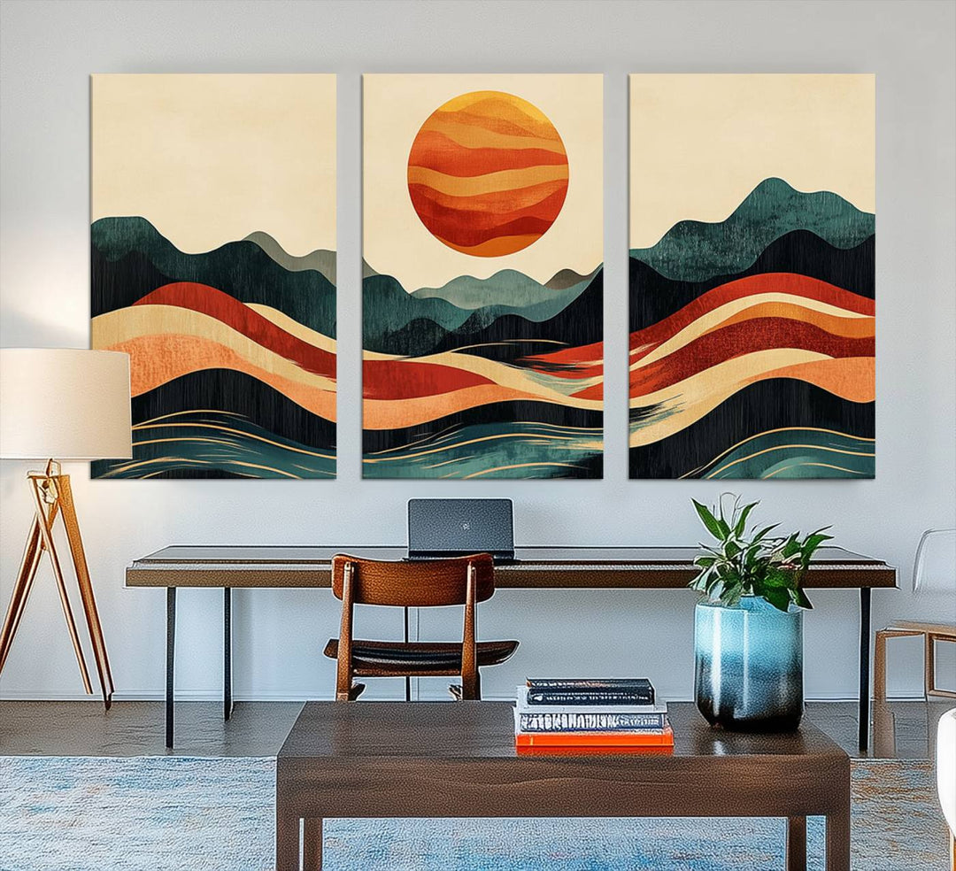 The Mountain Triptych wall art, featuring a design of the sun, mountains, and waves, is displayed prominently on the wall.