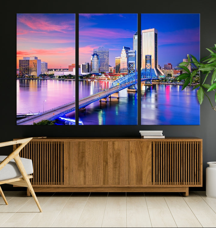 The Jacksonville Wall Art Canvas Print, showcasing the Jacksonville cityscape over a river at sunset, is elegantly crafted on museum-quality canvas with a UV-protective coating. Ready to hang, it elevates your space with its sophisticated charm.