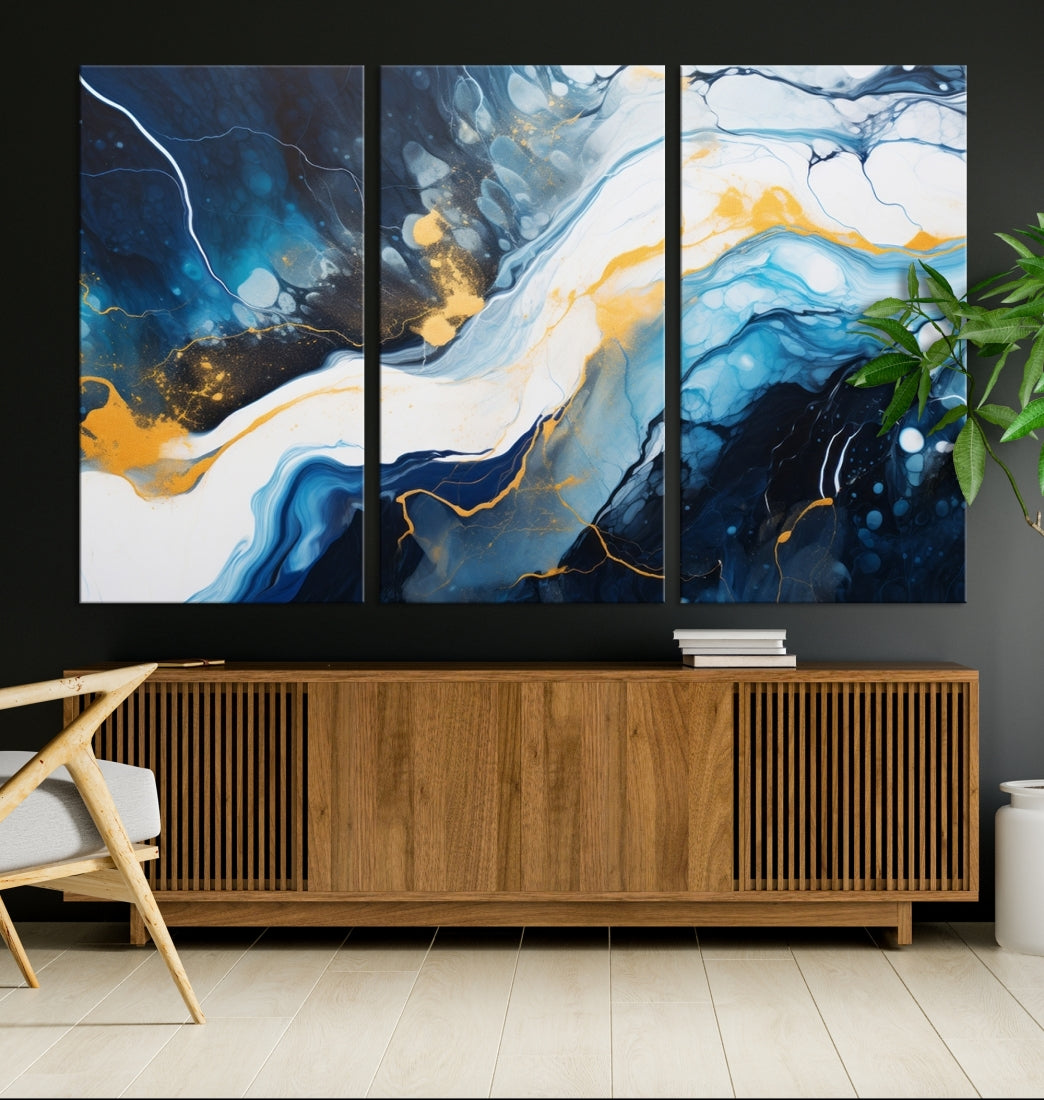 The Navy Blue Abstract Wall Art Canvas Print, displaying an exquisite array of blue, white, and gold swirls, is crafted on museum-quality canvas and enhances the space with its sophisticated elegance.