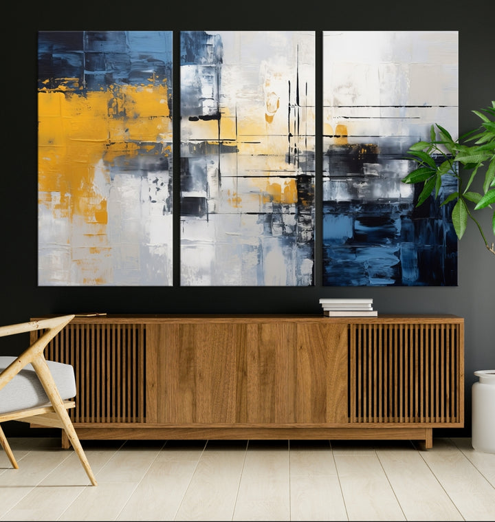 The Yellow Orange Blue Abstract Wall Art Print on gallery-wrapped, museum-quality canvases adds a vibrant touch to the room.