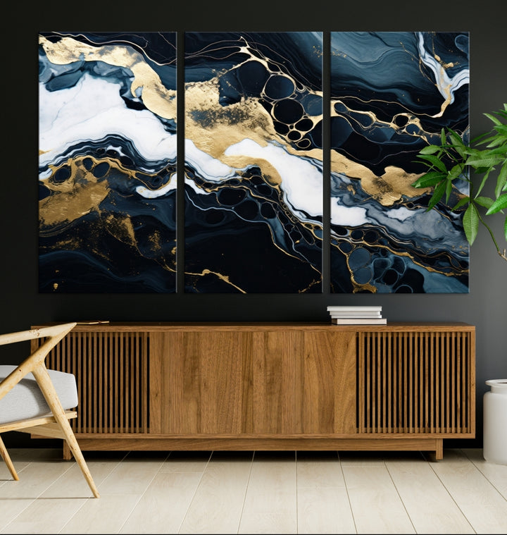 Fluid Marble Abstract Wall Art Print, a contemporary piece with black, white, and gold swirls on museum-quality canvas.