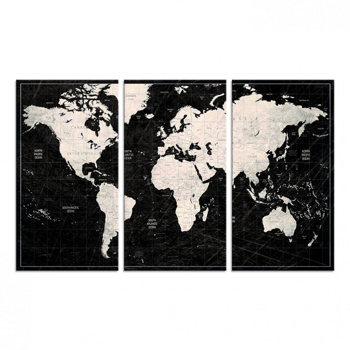 A bold global style framed black and white world map canvas print, presented in three panels, perfect for modern home or office decor.