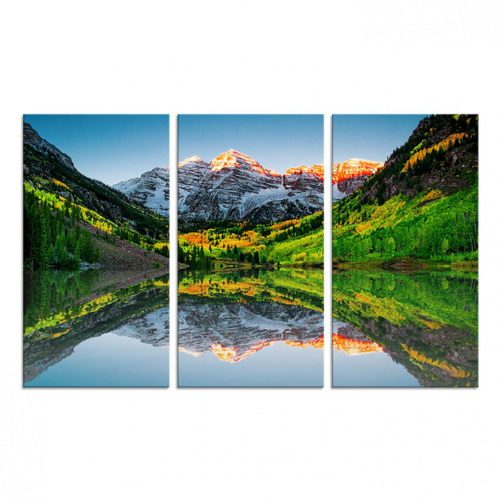 The Sunrise Maroon Bells Lake Wall Art Print beautifully captures North Maroon Peak mirrored in the tranquil lake, framed by lush greenery.