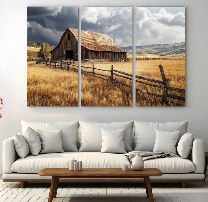 Canvas of a weathered wooden barn in a golden field under a dramatic sky, perfect for rustic or farmhouse-style wall decor.