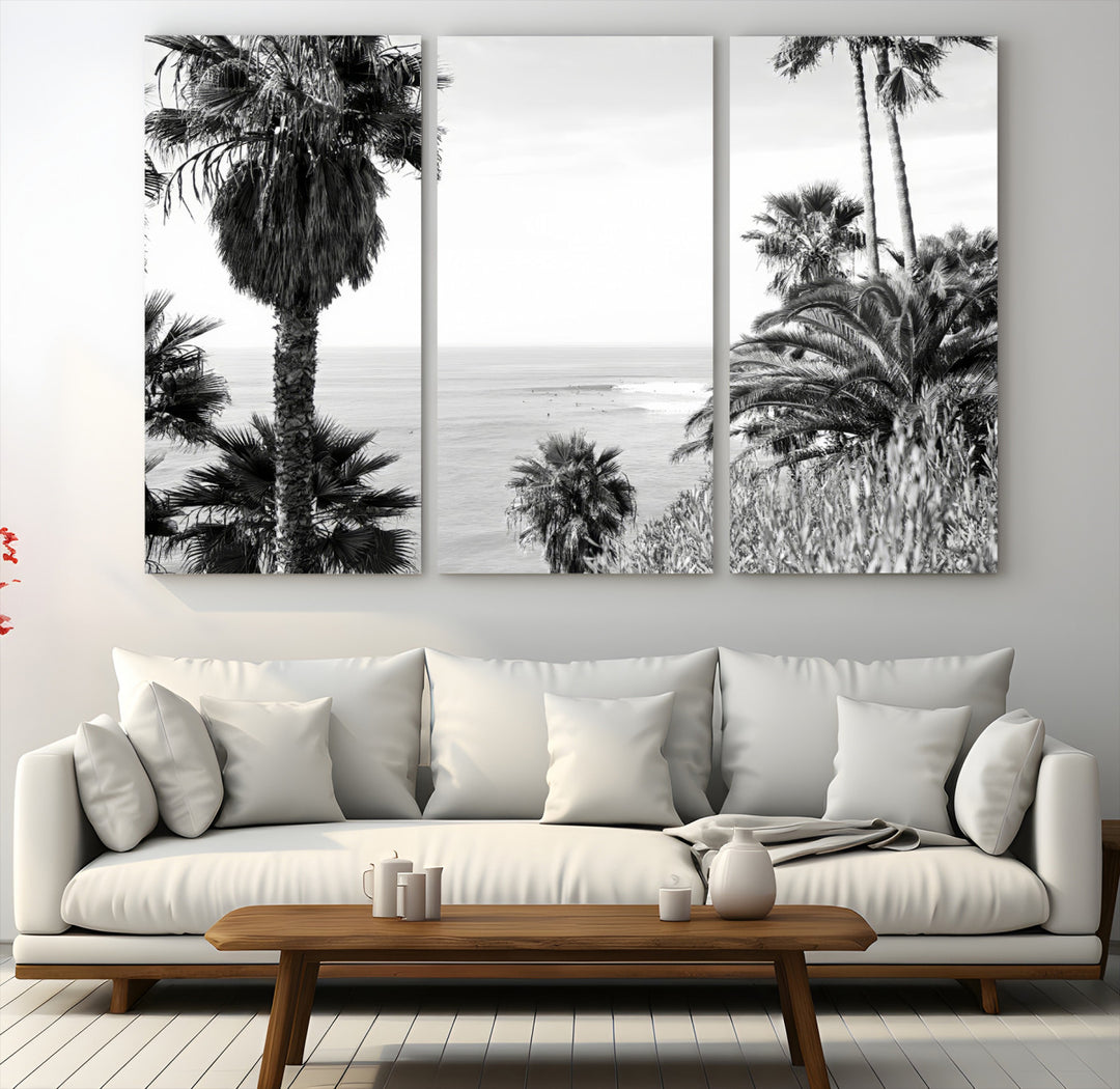 Monochrome canvas of palm trees framing a coastal surf scene, perfect for California-inspired or retro black-and-white beach decor.