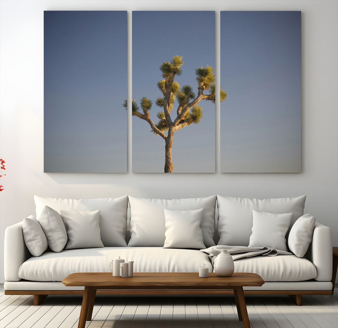 A lone Joshua Tree standing against a deep blue sky, capturing the serene and rugged beauty of the Southwestern desert landscape.