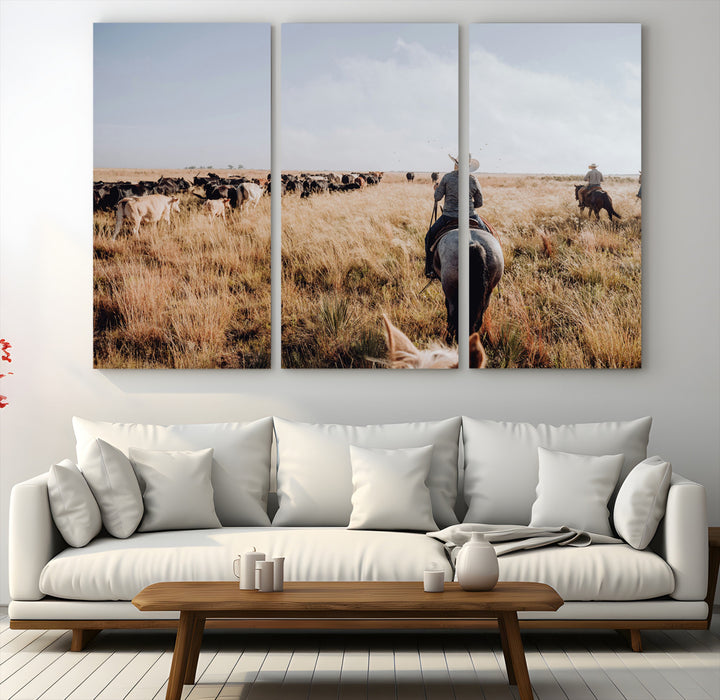 A cowboy and cowgirl on horseback herding cattle through golden grasslands, capturing a rustic and authentic Western ranch lifestyle.