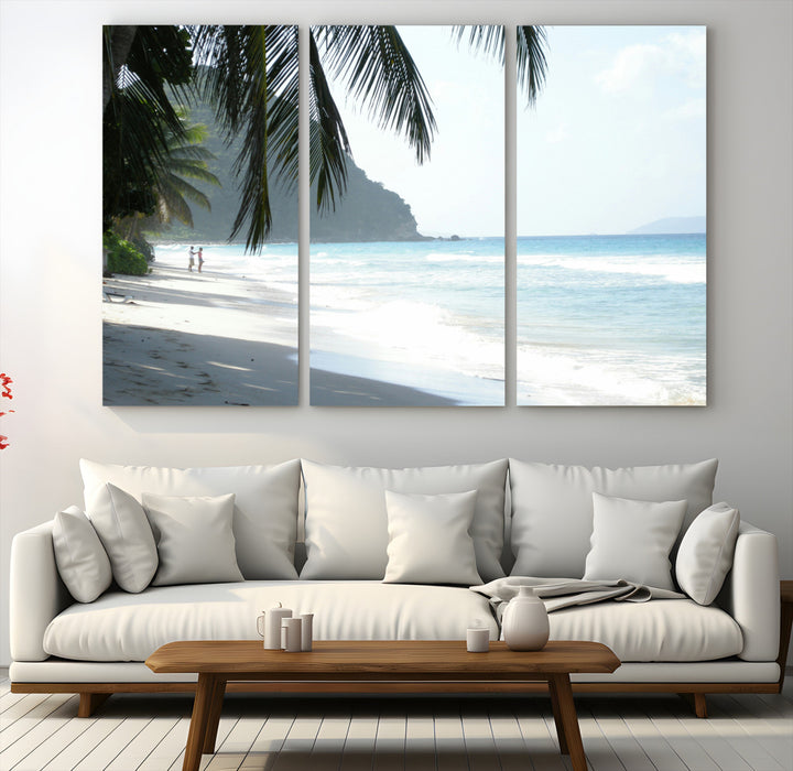 Tropical beach with palm tree shadows, white sand, and turquoise ocean waves, creating a serene and relaxing island escape atmosphere.