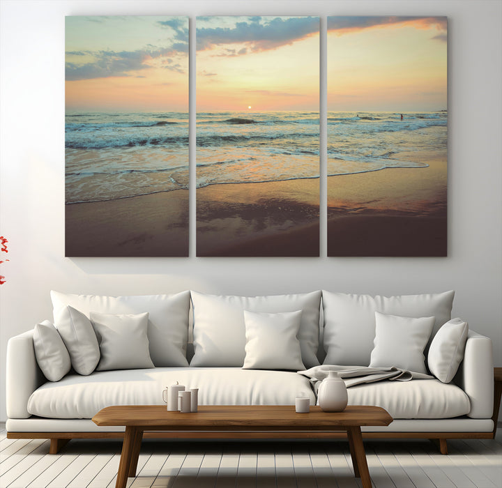 Warm sunset over gentle ocean waves with pastel sky and reflections on wet sand, creating a calm and soothing beach ambiance.