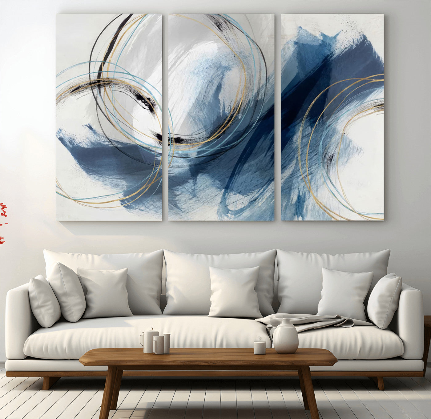 Abstract wall art featuring dynamic brush strokes in shades of blue and gray, overlaid with delicate circular line patterns in gold, black, and light blue on a white background.