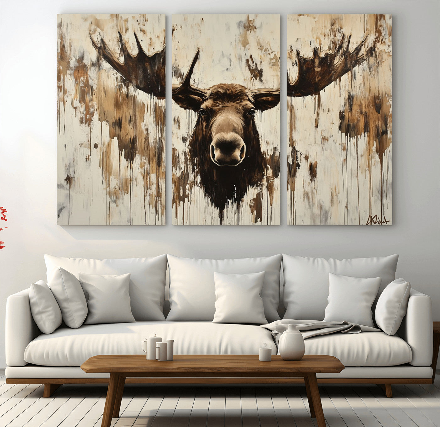 Expressive painting of a moose head with wide antlers in dark brown and beige tones, featuring paint drips and splatters on a light textured background, creating a striking rustic wall art canvas.