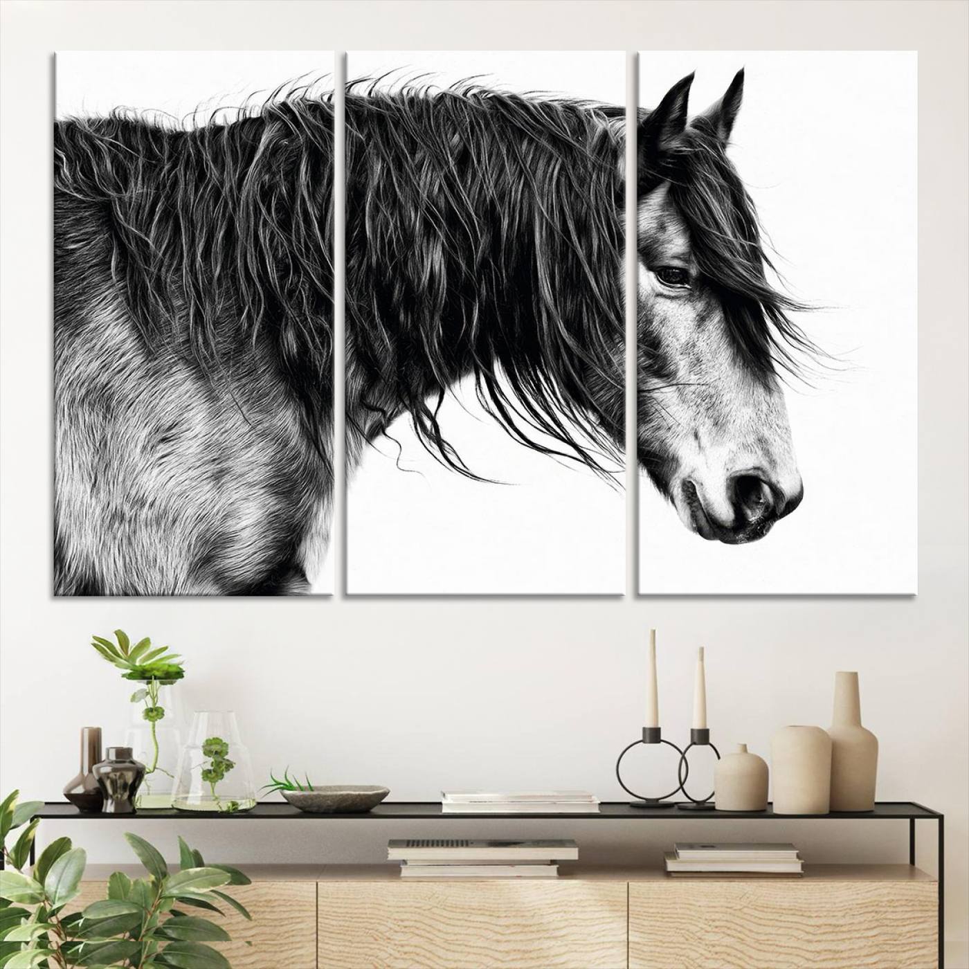 A stunning black-and-white portrait of a horse with a flowing mane, captured in dramatic detail and emotion.