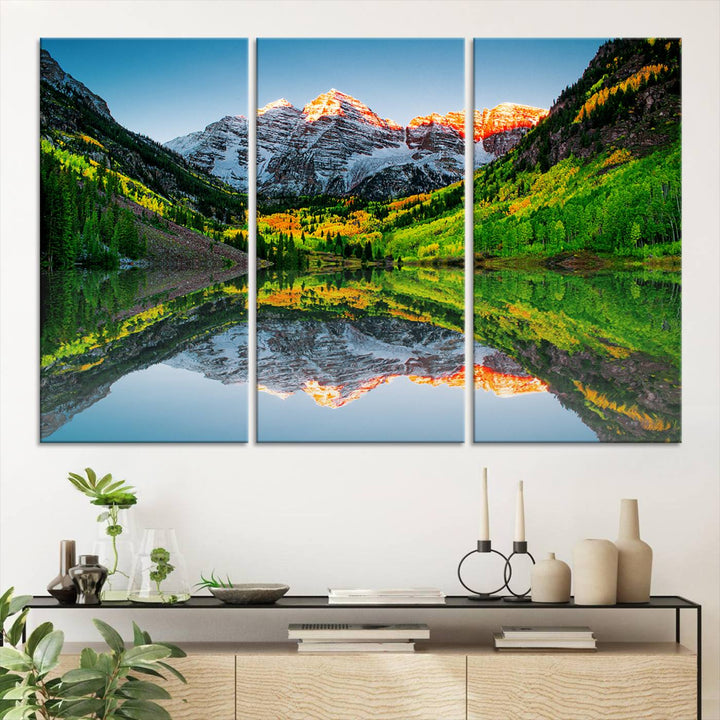 The Sunrise Maroon Bells Lake Wall Art Print beautifully captures North Maroon Peak mirrored in the tranquil lake, framed by lush greenery.