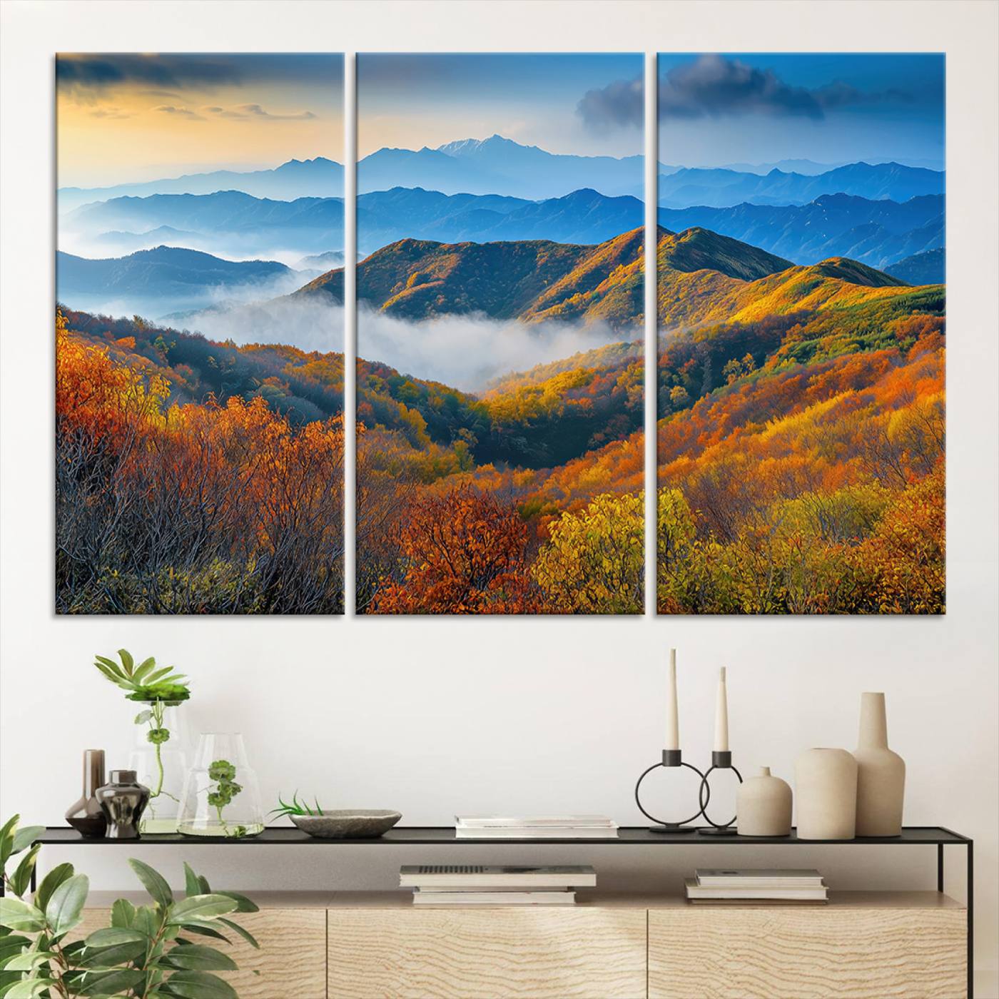 Vibrant canvas of autumn mountains with colorful trees, layered blue ridges, and soft morning fog, ideal for bright nature-themed decor.