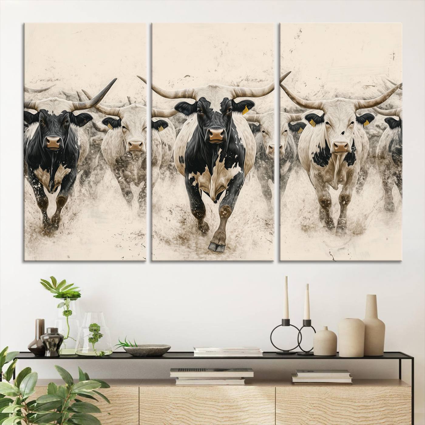 Canvas artwork of Texas Longhorn bulls walking in a dusty herd, ideal for rustic Western or country-style interior decor.