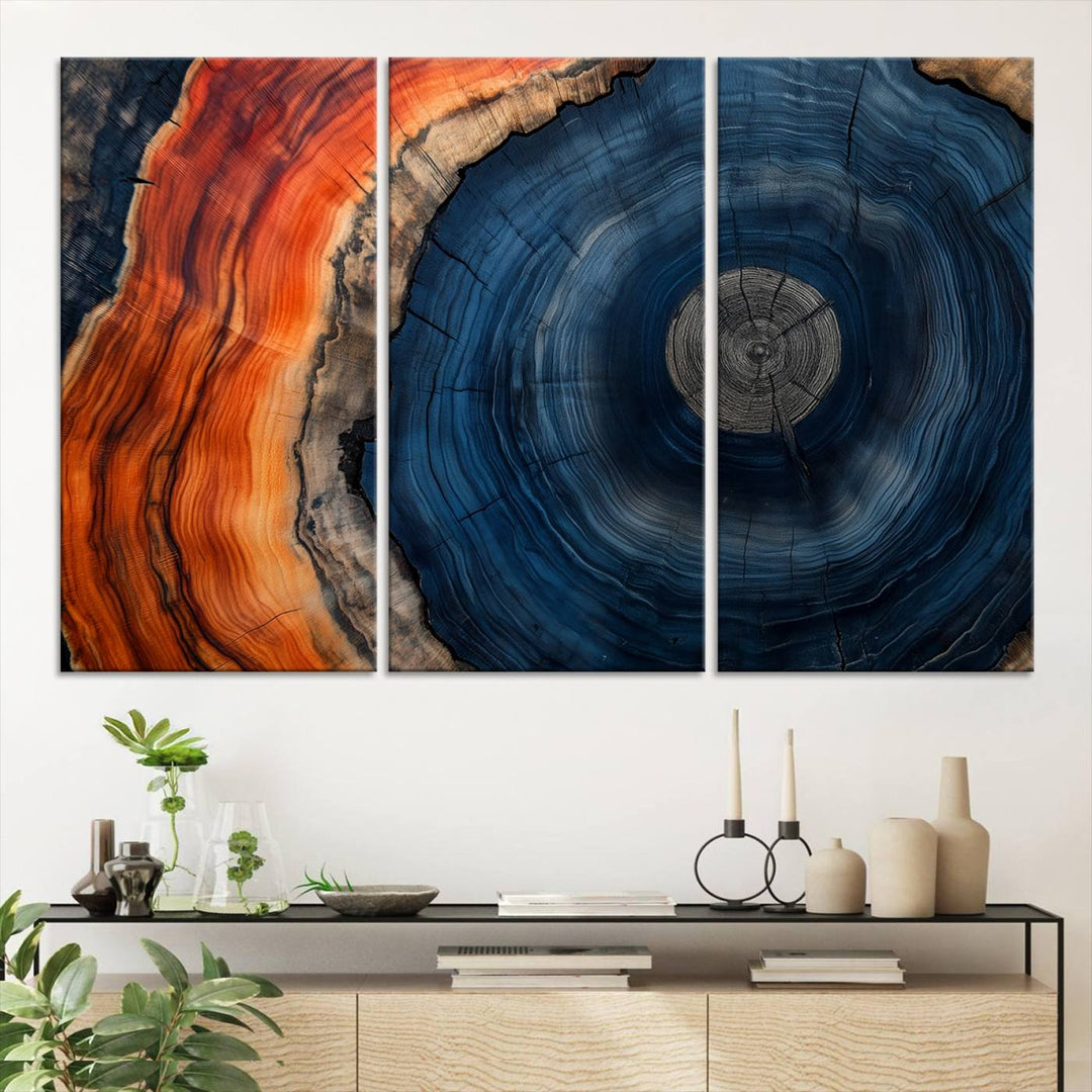 Abstract Tree Ring Wall Art Print on canvas featuring vibrant blue, orange, and brown rings with a natural rustic wood texture. Free shipping available!.