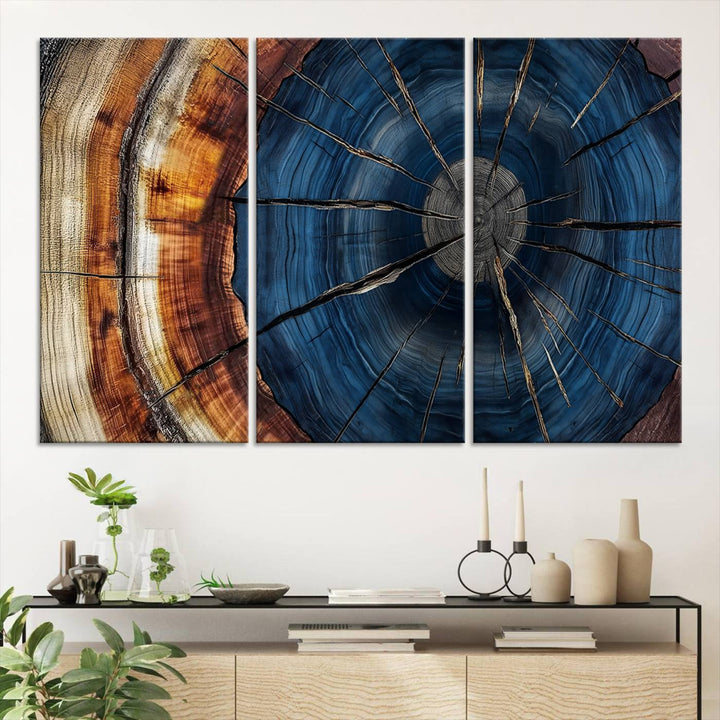 The Abstract Tree Rings Canvas Print features blue, brown, and orange rings that highlight wood grain and natures beauty.