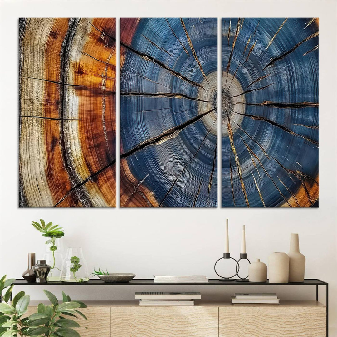 Close-up of blue, brown, and orange wood grain rings on the Abstract Tree Rings Canvas Wall Art Print.