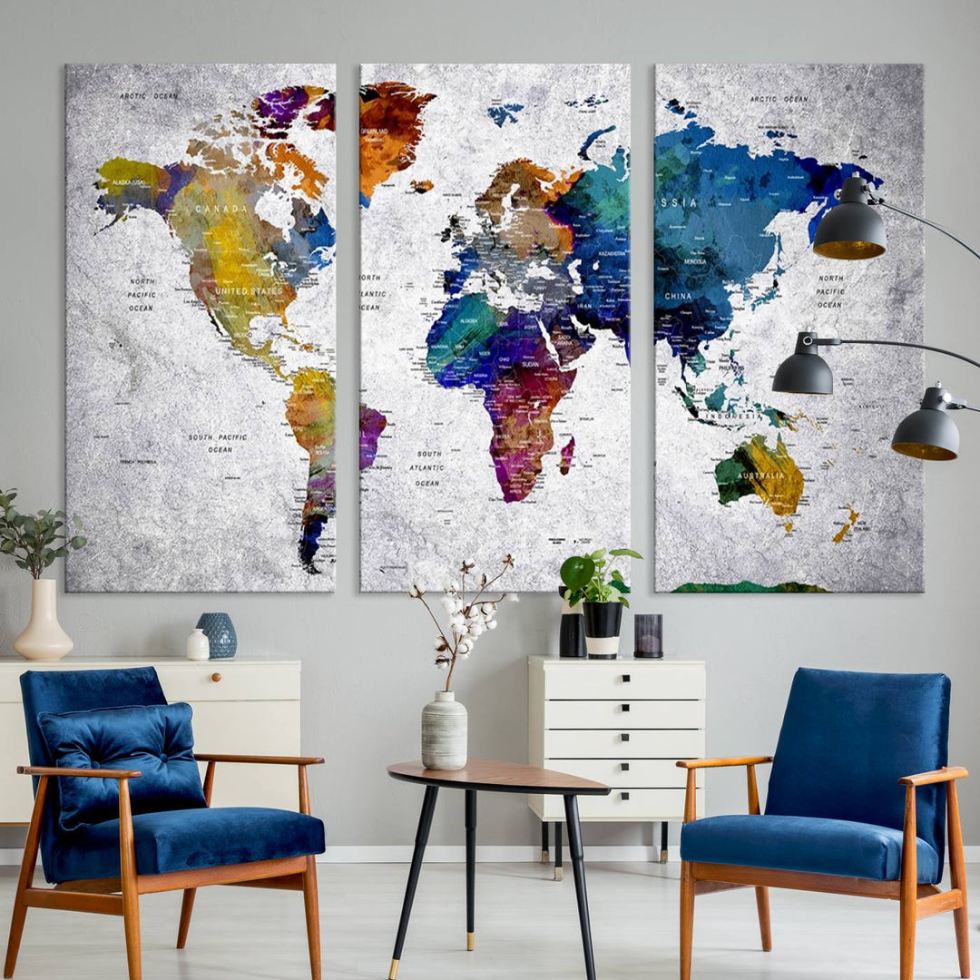 The World Map Art Canvas Print, featuring country names on a grunge-stained gray background, is perfect for stylish home decor.