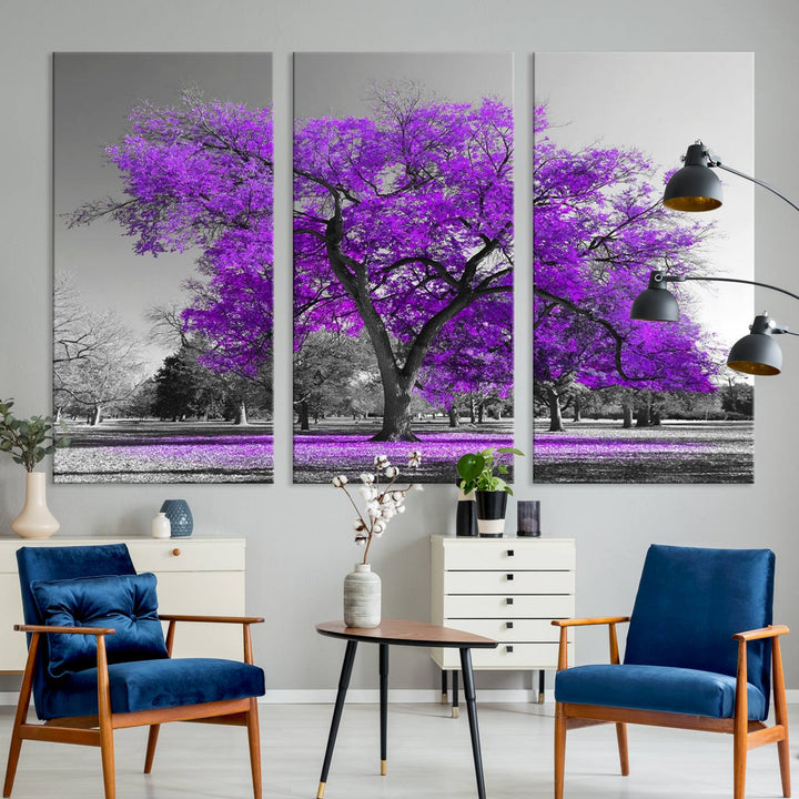 The Big Purple Tree Wall Art Canvas Print showcases a vibrant purple tree set against a black-and-white landscape.