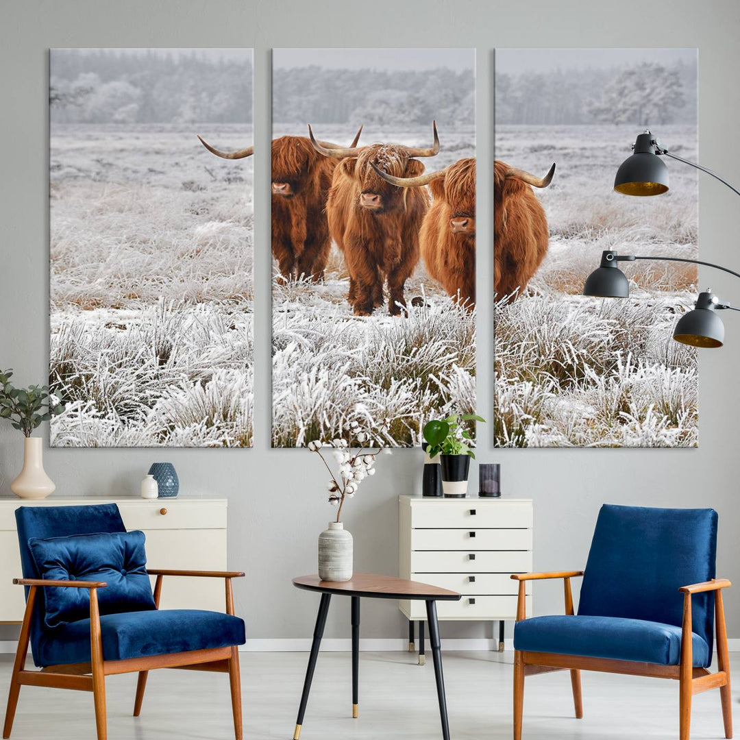 The Highland Cows in Snow canvas showcases three cattle in a frosty field.