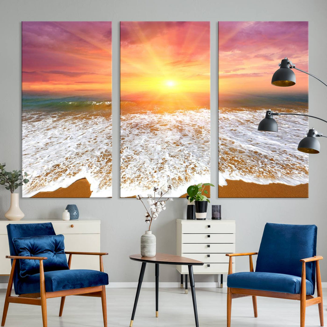 Golden Beach Sunrise 3-panel canvas art of ocean waves, hung on a wooden wall.