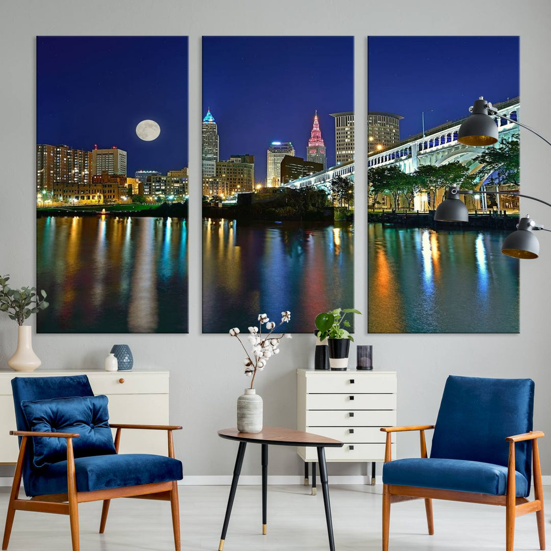 Cleveland City Lights Night Skyline Wall Art canvas showcases a moonlit cityscape reflected on water.