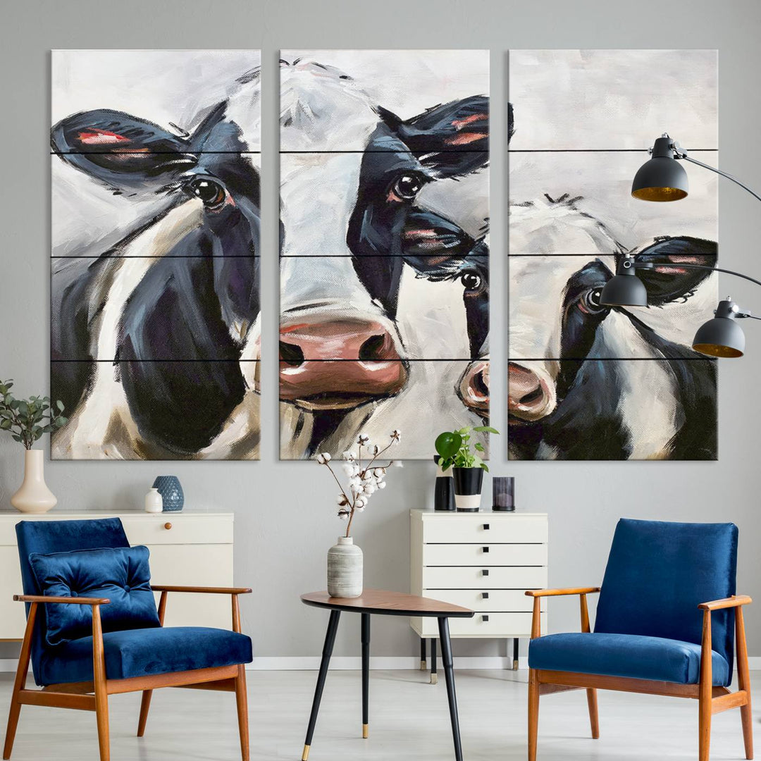 The Vintage Baby and Mom Cattle Canvas, featuring cows with black and white patches, is a prominent piece of wall art.