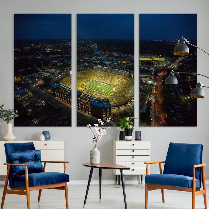 Aerial view of Michigan Stadium at night, surrounded by city lights, depicted on a Michigan Wolverines wall art canvas print.