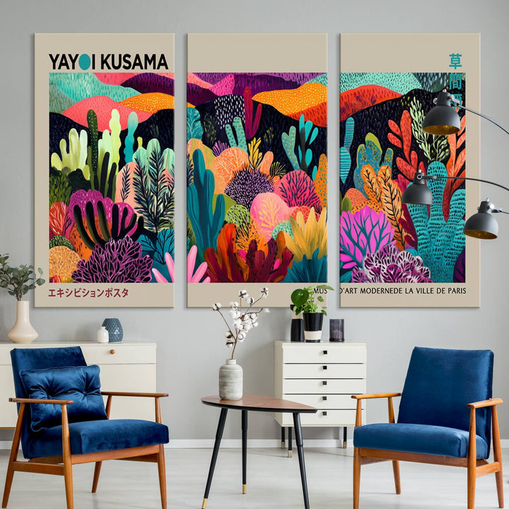 The framed Yayoi Kusama wall art adds vibrancy above the blue couch.