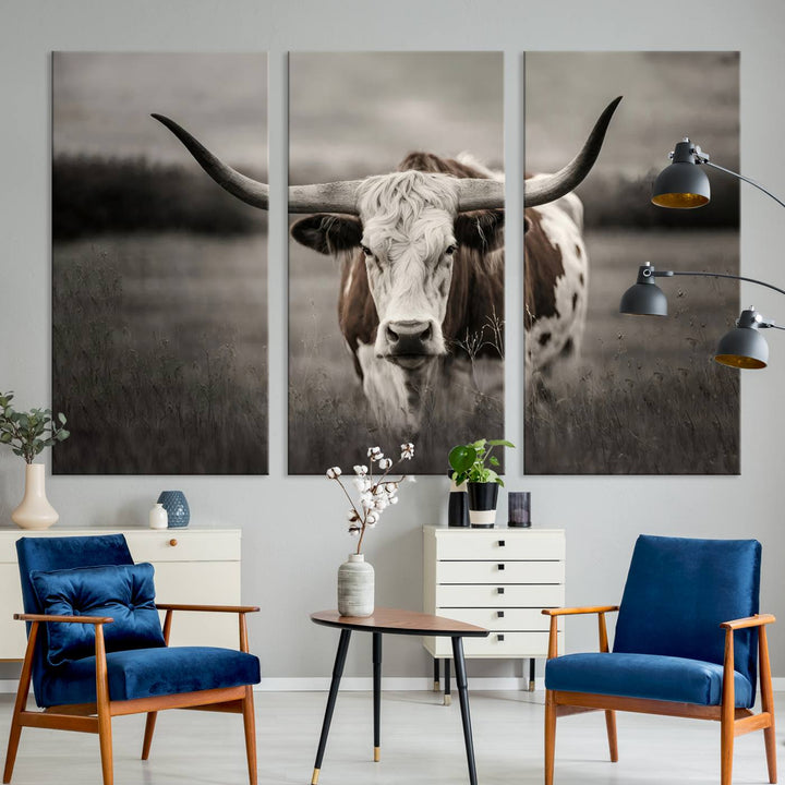 The Texas Longhorn Cow Canvas Wall Art Print adds a rustic touch to a living room.